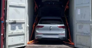Vehicle secured with straps inside a container, illustrating how packing changes the billable volume of a shipment